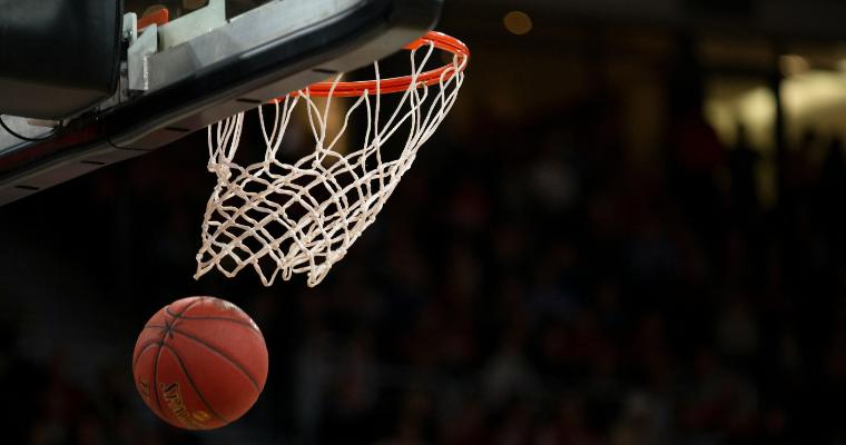 Ball under basketball rim after basket image link to article