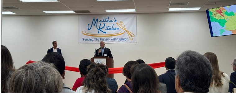 Photo of Drew Starbird Speaking at Marthas Kitchen Grand Opening