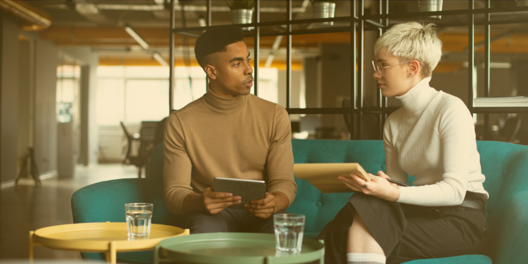 Photo of two people having a meeting