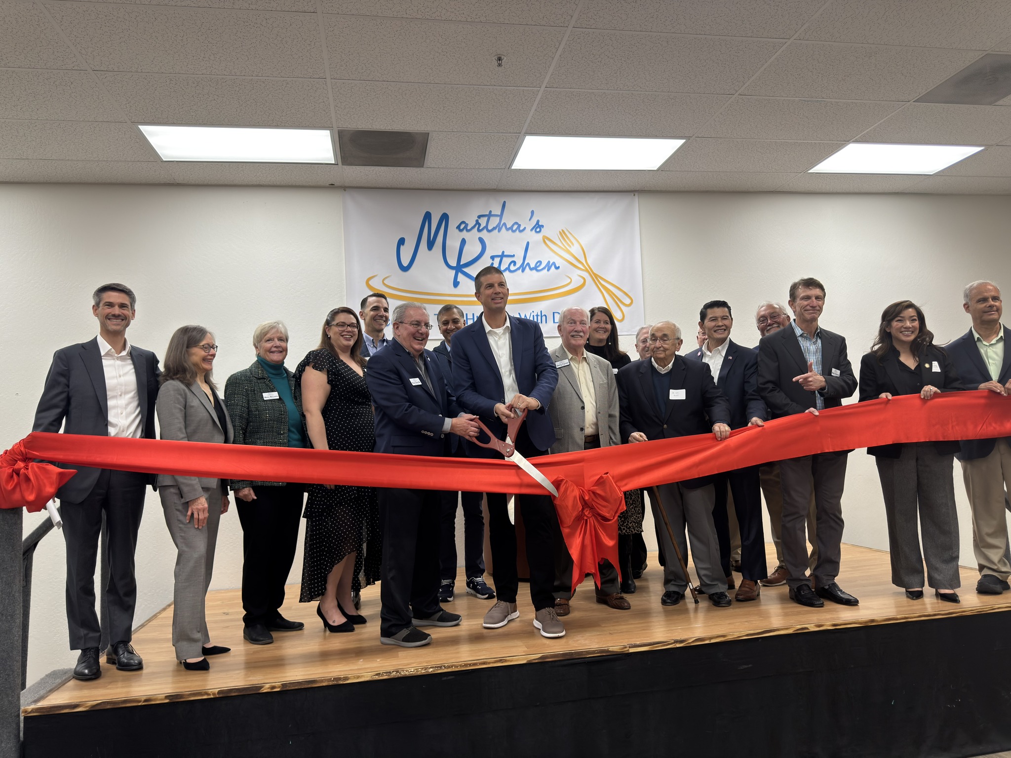 Ribbon Cutting at the Grand Opening of Marthas Kitchen Food Hub - Photo source Marthas Kitchen Facebook page.