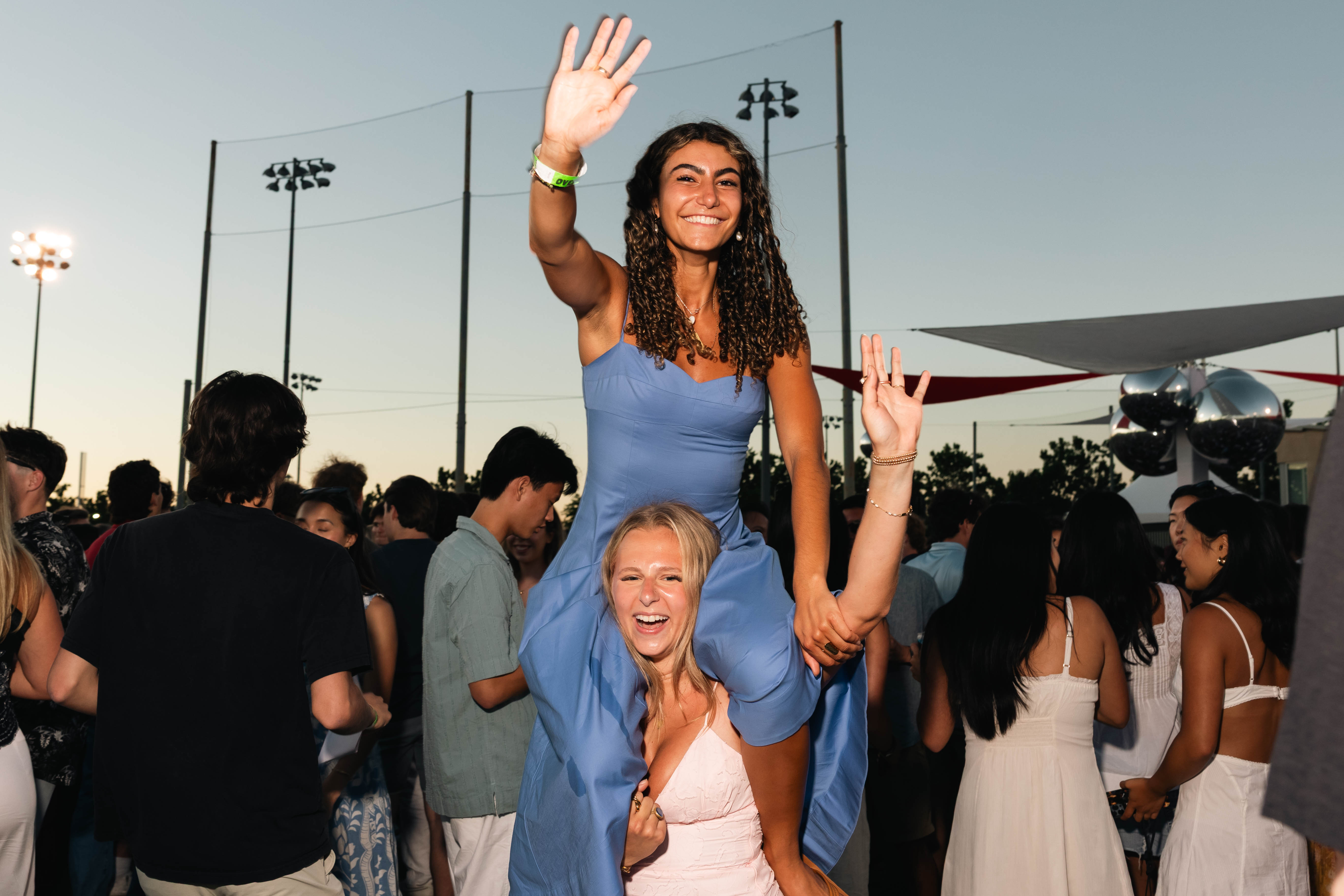 Alumni on her friends shoulders
