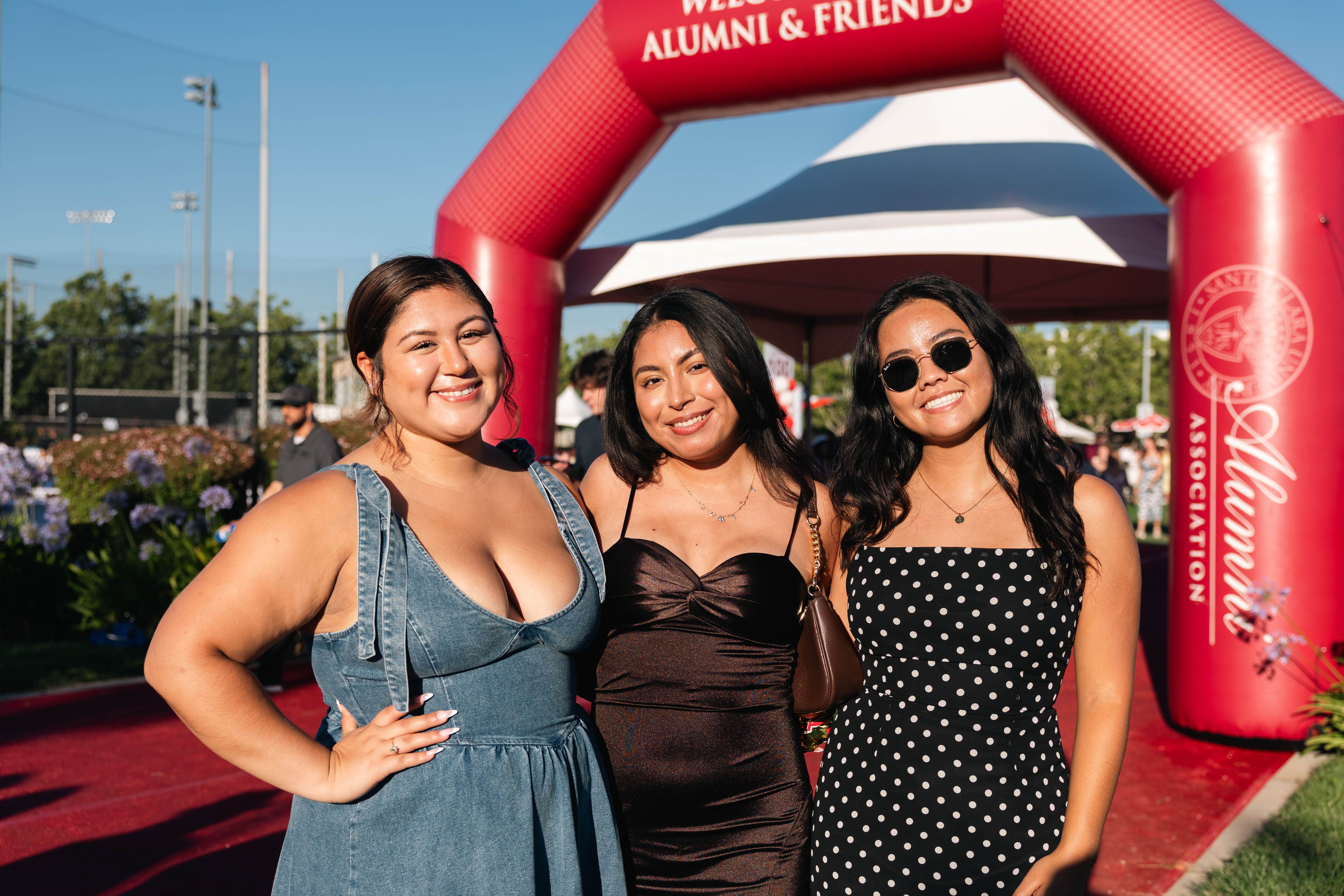 Three girls smiling at camera