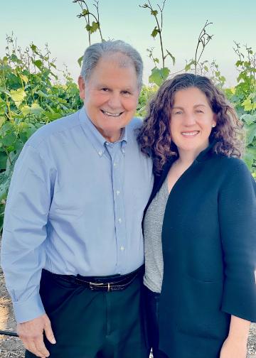 Lisa H. Franzia 96 with her father, Joseph S. Franzia 64, MBA 65 at a Bronco Wine Company vineyard. Photo courtesy of the Franzia family.
