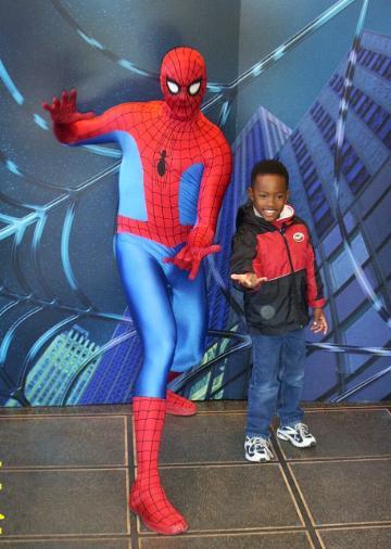 Person posing with someone in a Spider-Man costume at Universal Studios, 2002.