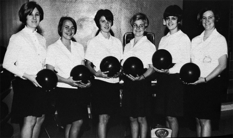Six women holding bowling balls, posing as a 1968 womens bowling team.