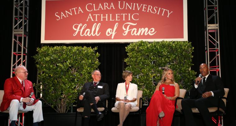 Five people in chairs onstage under Shoal Creek Conservancy Founders Hall of Fame sign.