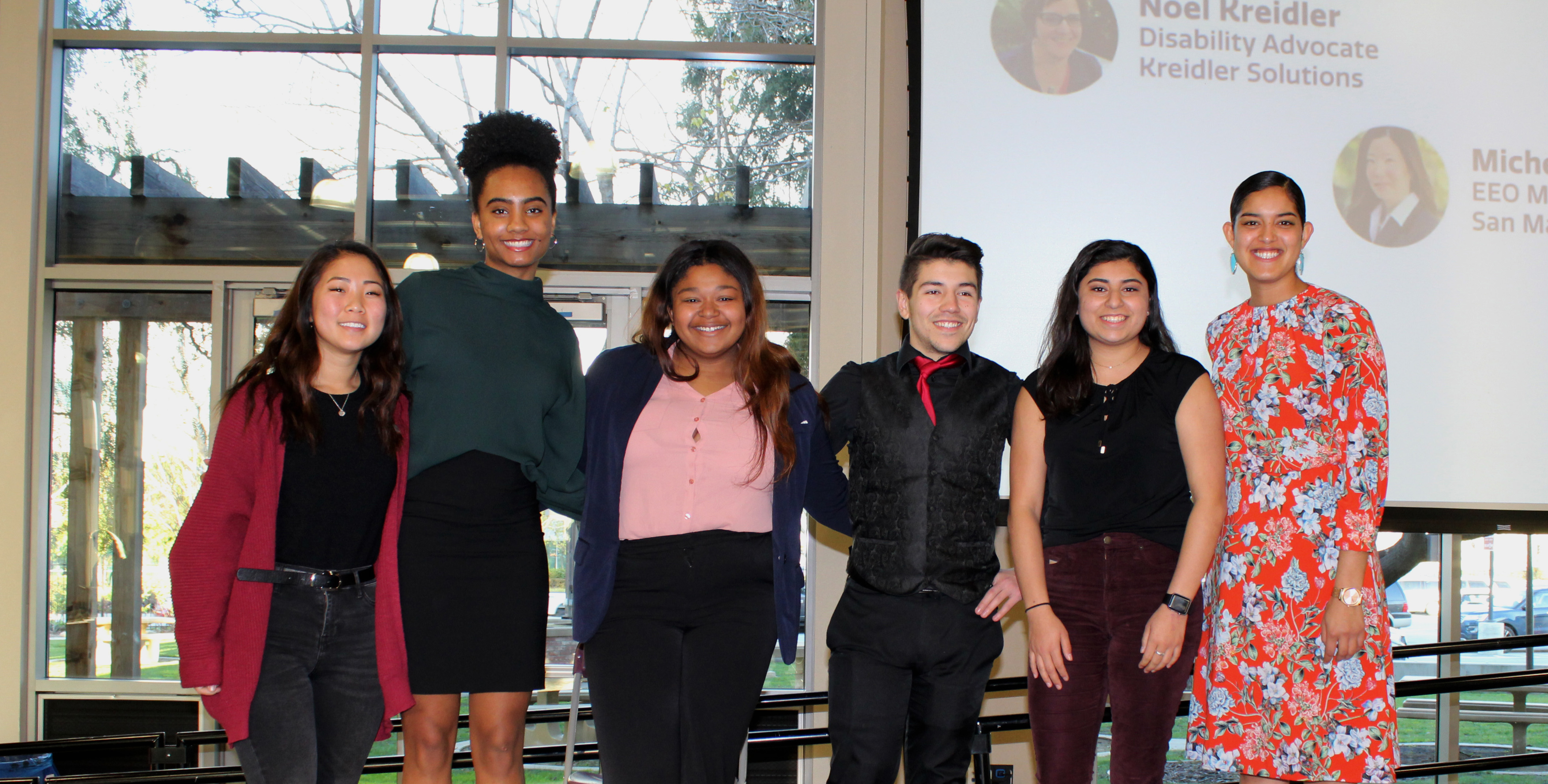 Group of six people in front of Diversity Works 2019 Winners banner.
