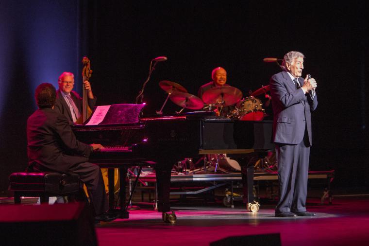 Tony Bennett performing on stage with pianist in 2016.