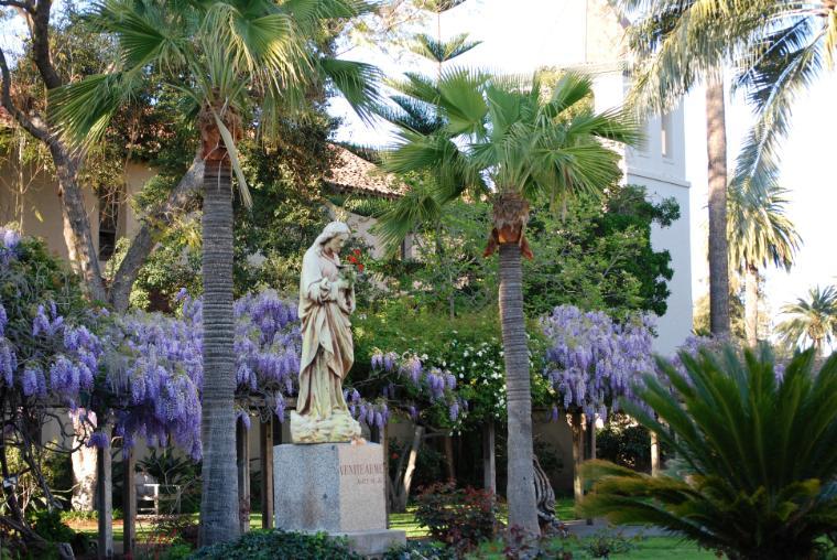 The statue of the Sacred Heart of Jesus sits atop the old Mission well.  