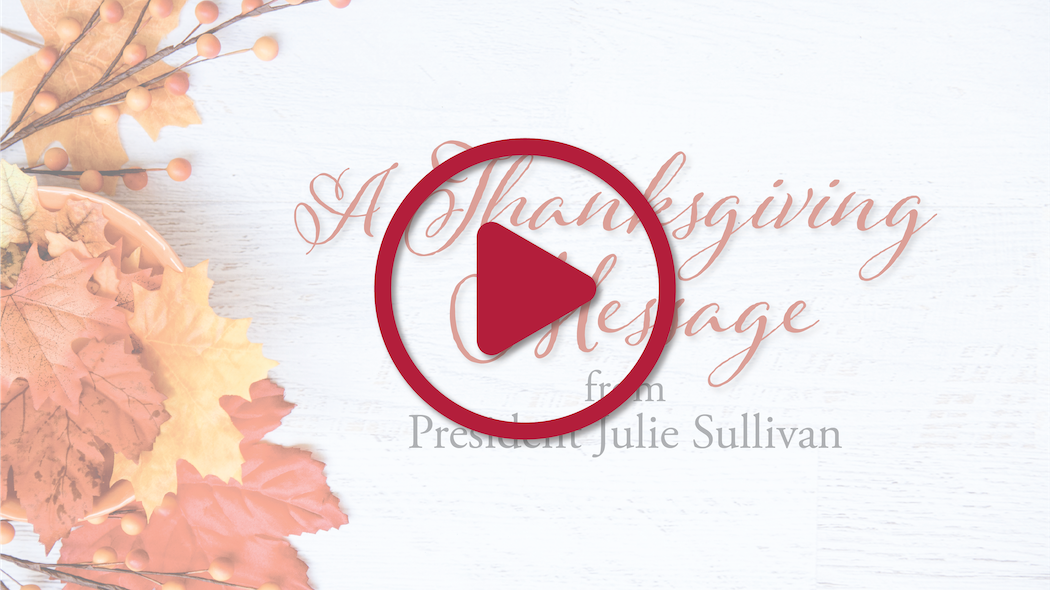 Thanksgiving Message text with a red play button and autumn leaves.