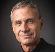 Head shot of man in black shirt