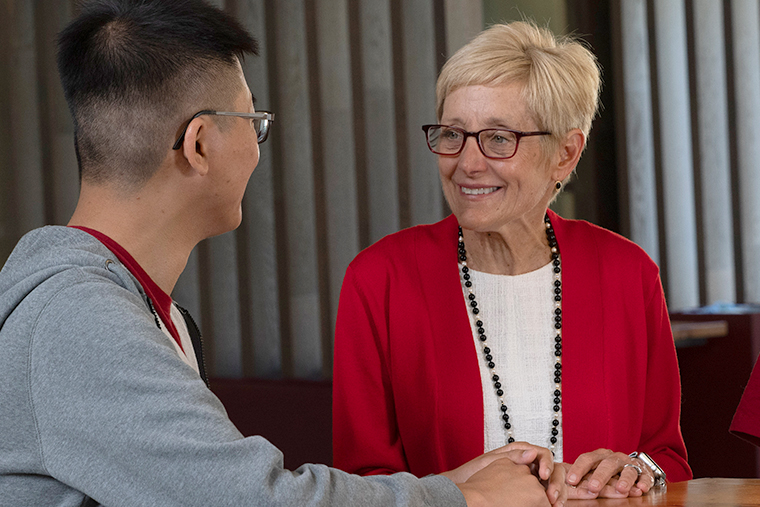 SCU President Julie Sullivan speaks with a student