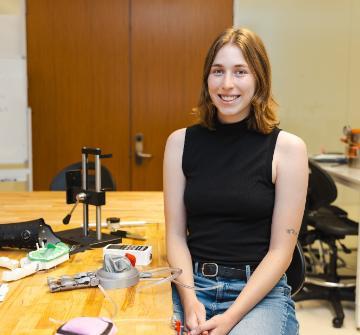 Jacqmotte-Parks in the DART Lab with the prosthetic hand prototype.