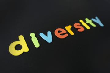 Colorful letters spelling diversity on a black background.