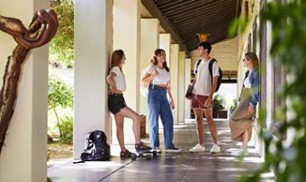 Four Students Talking Casually 