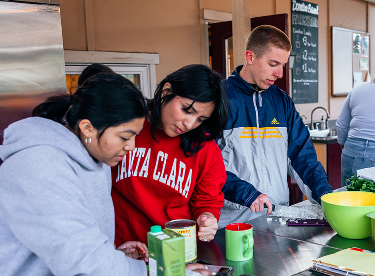 Students preparing a Nourish Nights Meal in the Forge Garden Outdoor Kitchen 
