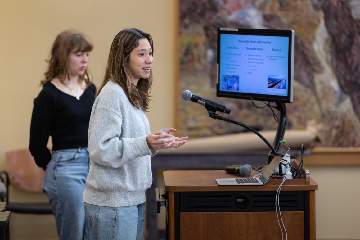 A student presenting at symposium