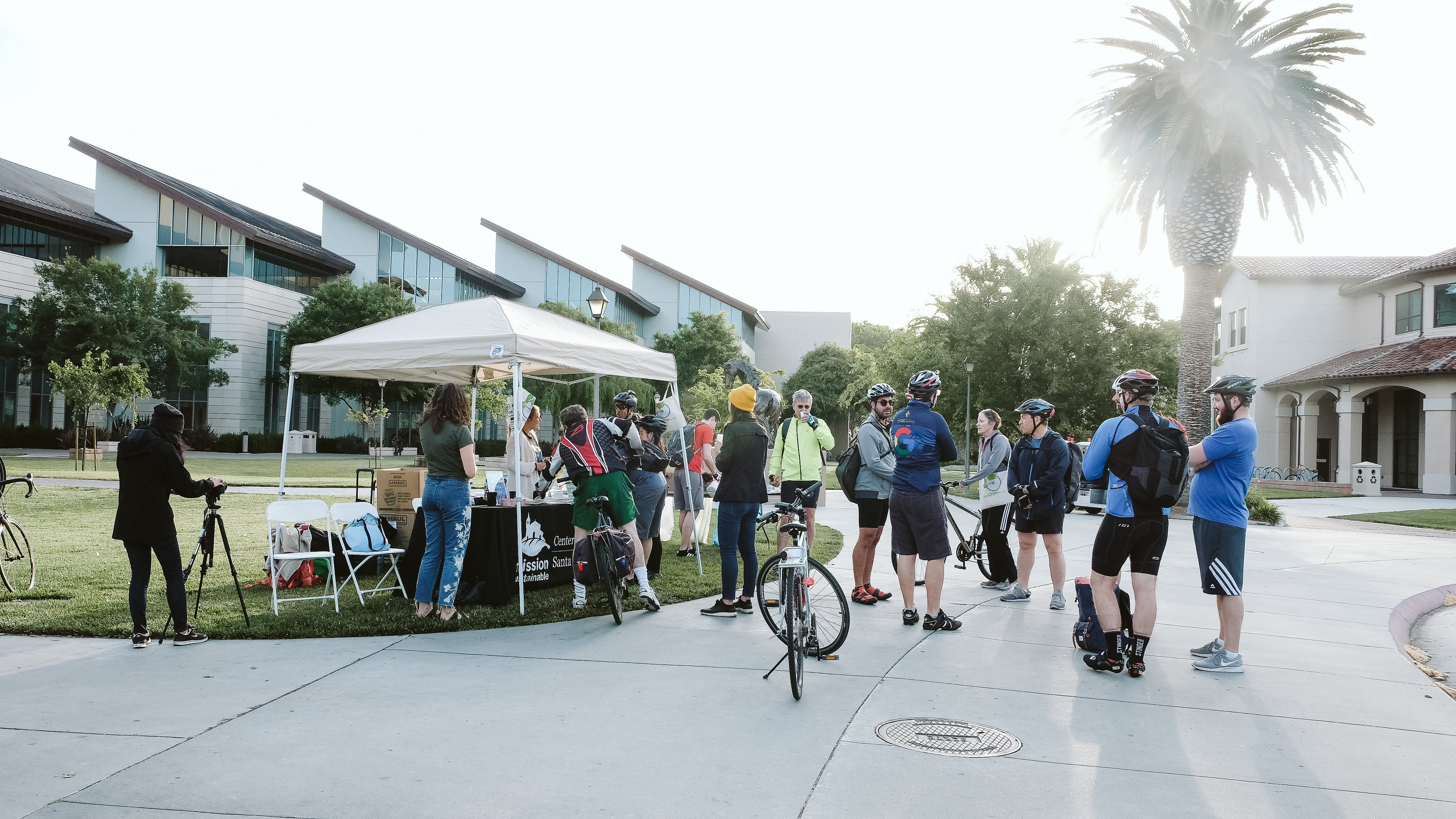 Many cyclists gathering near SCUs Energizer Station for snacks and goodies.