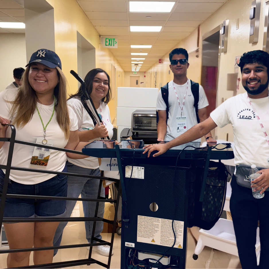 Group of students smiling and showing the room items they found at Bronco Surplus