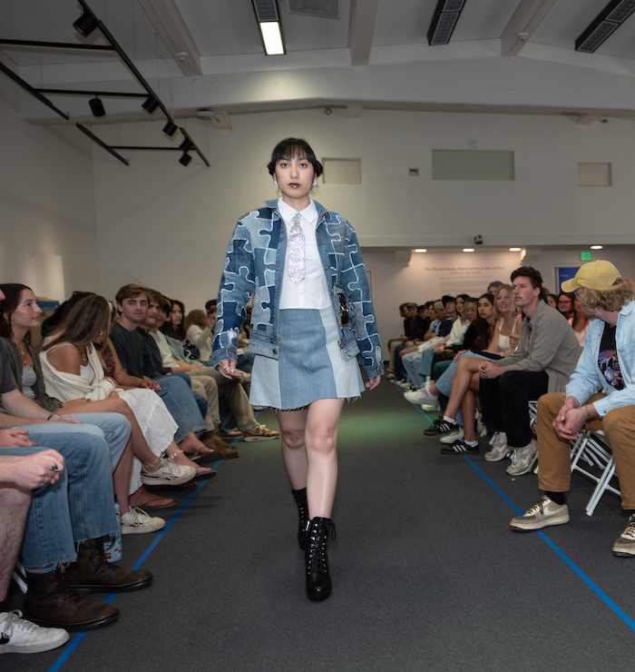 Student in denim at the eco fashion show on the runway