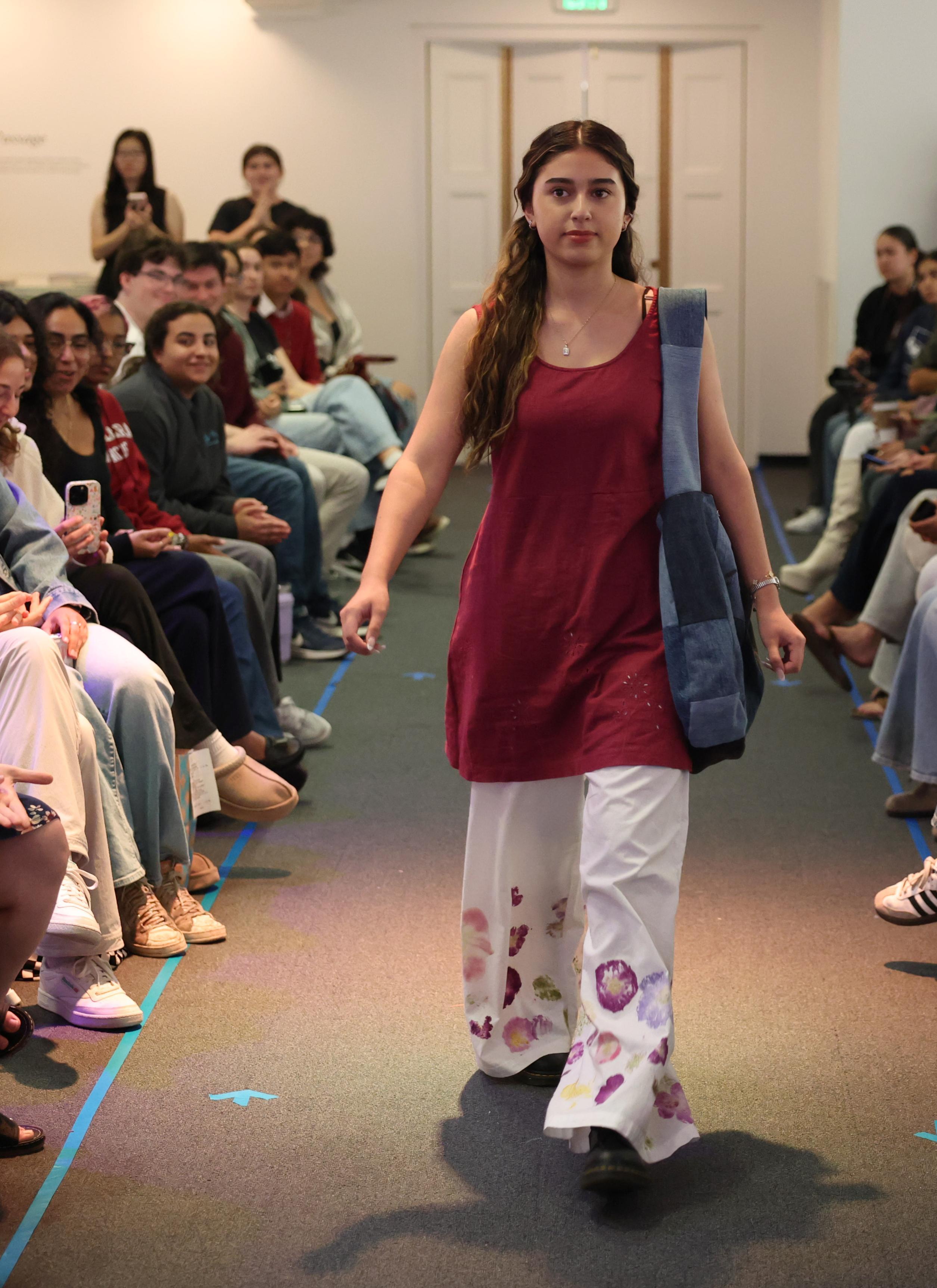 EcoFashion Show 2026 Model on runway wearing an outfit dyed with flowers