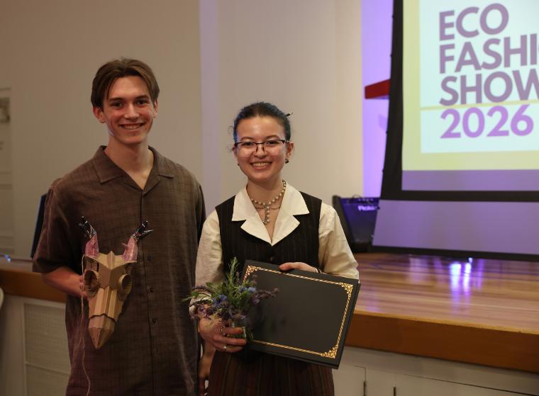 EcoFashion Show 2026: Student Designer and Model holding award for design The Stag