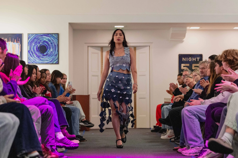 Student model walking down a runaway at EcoFashion Show 2026