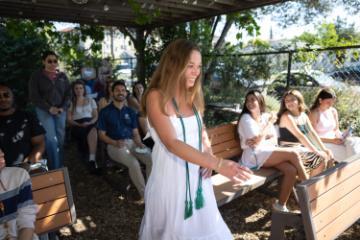 2025 Sustainability Celebration: A student walks past an audience to receive an award. image link to story