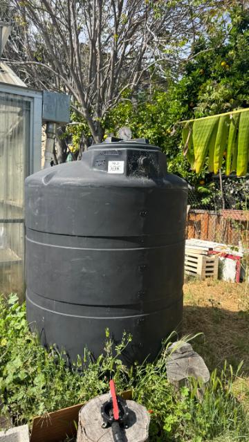 Rainwater catchment tank in the forge garden