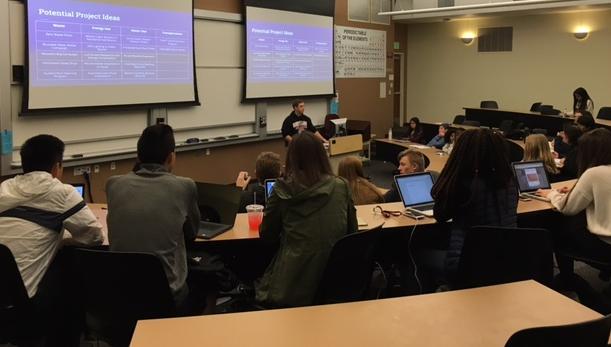 People listening to a presentation in a classroom