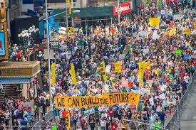Large crowd at a climate change protest organized by 350.org.