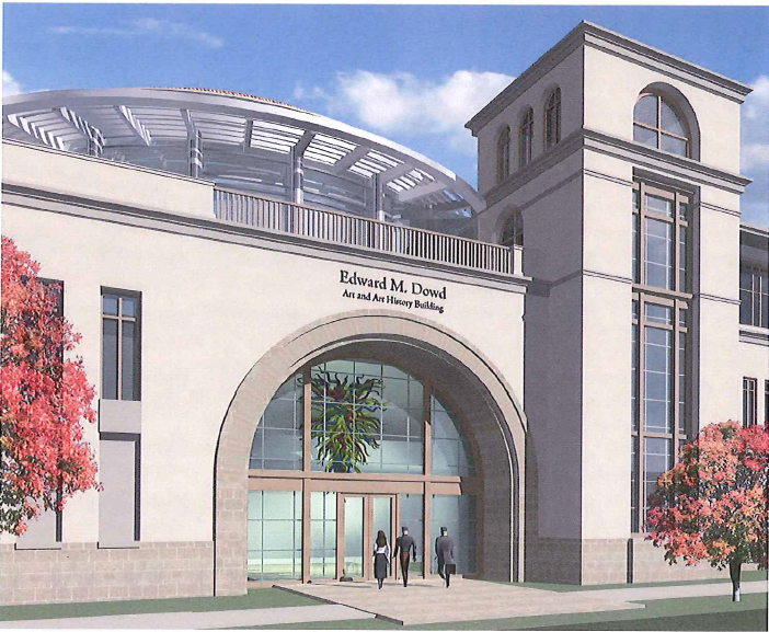 Modern building entrance with large archway and glass doors. image link to story