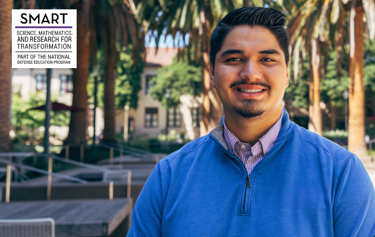 Julian Clark 27 poses in the SCDI courtyard at Santa Clara University