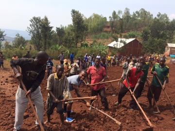Uche Agwu (MECH 18) and EWB students worked along side at least 200 community members as they worked to level the site for a K-3 elementary school in Rwanda. image link to story