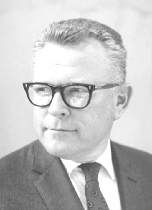 A person in a suit and glasses, titled Robert.