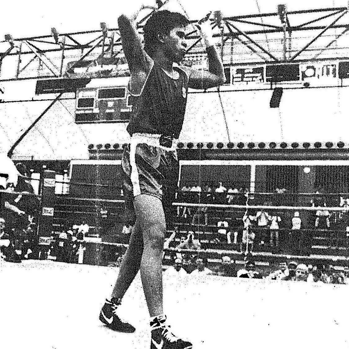 1990 national collegiate boxing champion Vince Llorin 92 takes a victory lab. Photo by Tim Currier. image link to story