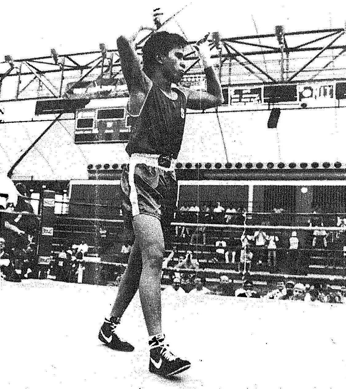 1990 national collegiate boxing champion Vince Llorin 92 takes a victory lap. Photo by Tim Currier. image link to story