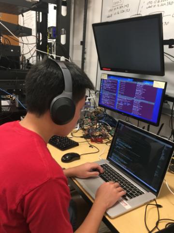 Simon Liu 20 at work in the SCU Internet of Things Laboratory