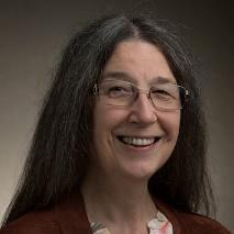 Person with glasses smiling, titled Ruth Davis.
