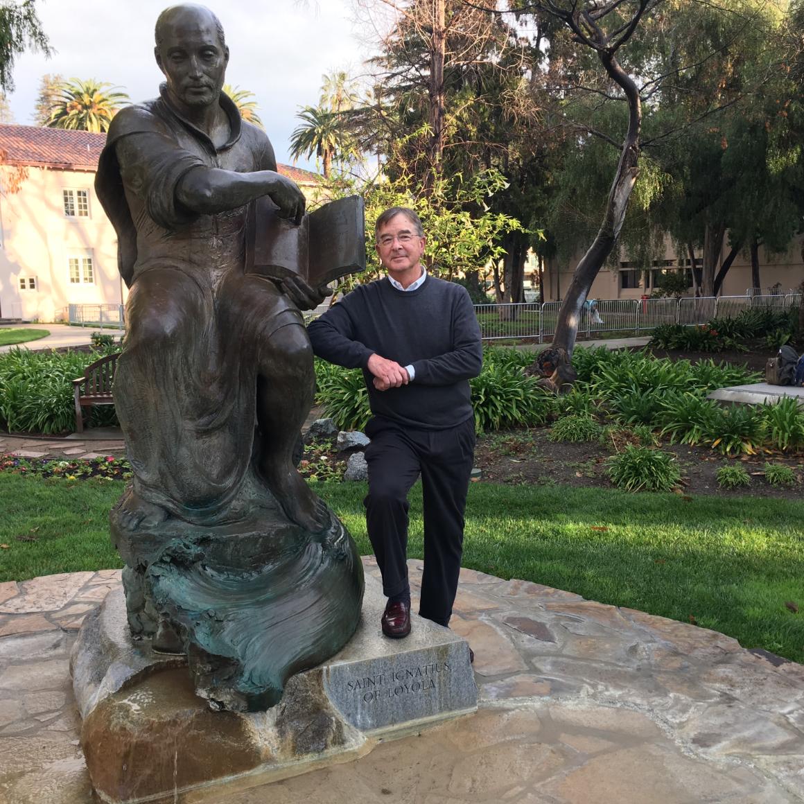 Lanny Vincent with SCUs statue of St. Ignatius image link to story