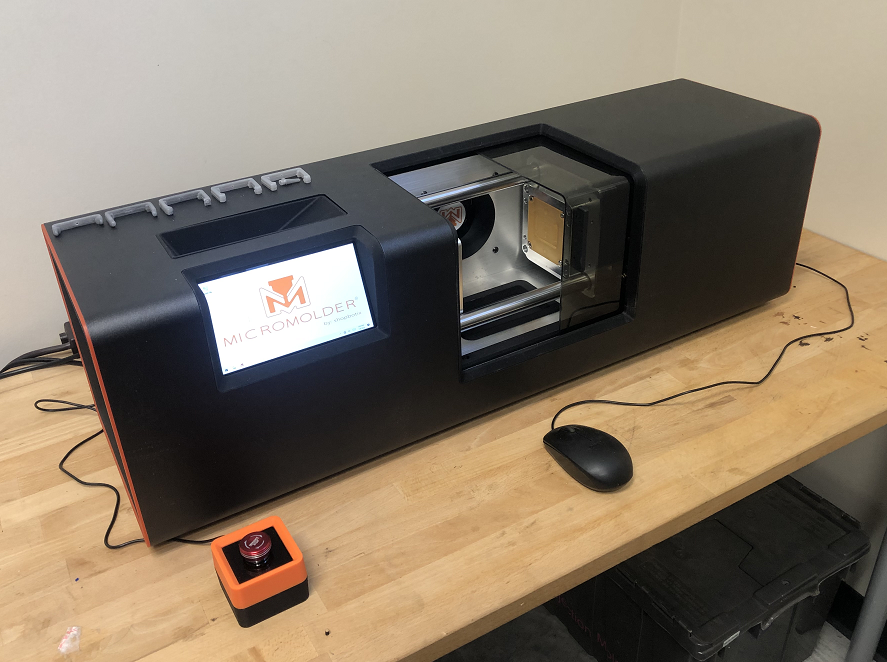 Micromolder injection molder on a table