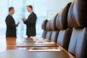 Members of the board consult.