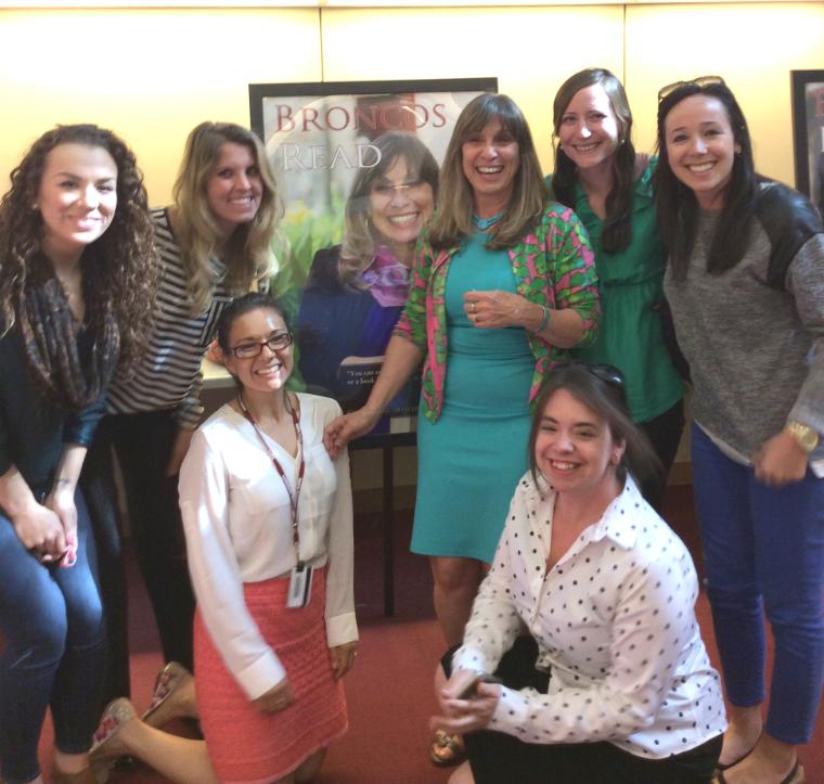 Leslie Leonetti 73 (Class Giving Officer for the Office of Development) celebrates with her colleagues that nominated her for the 2015 Broncos Read Poster.